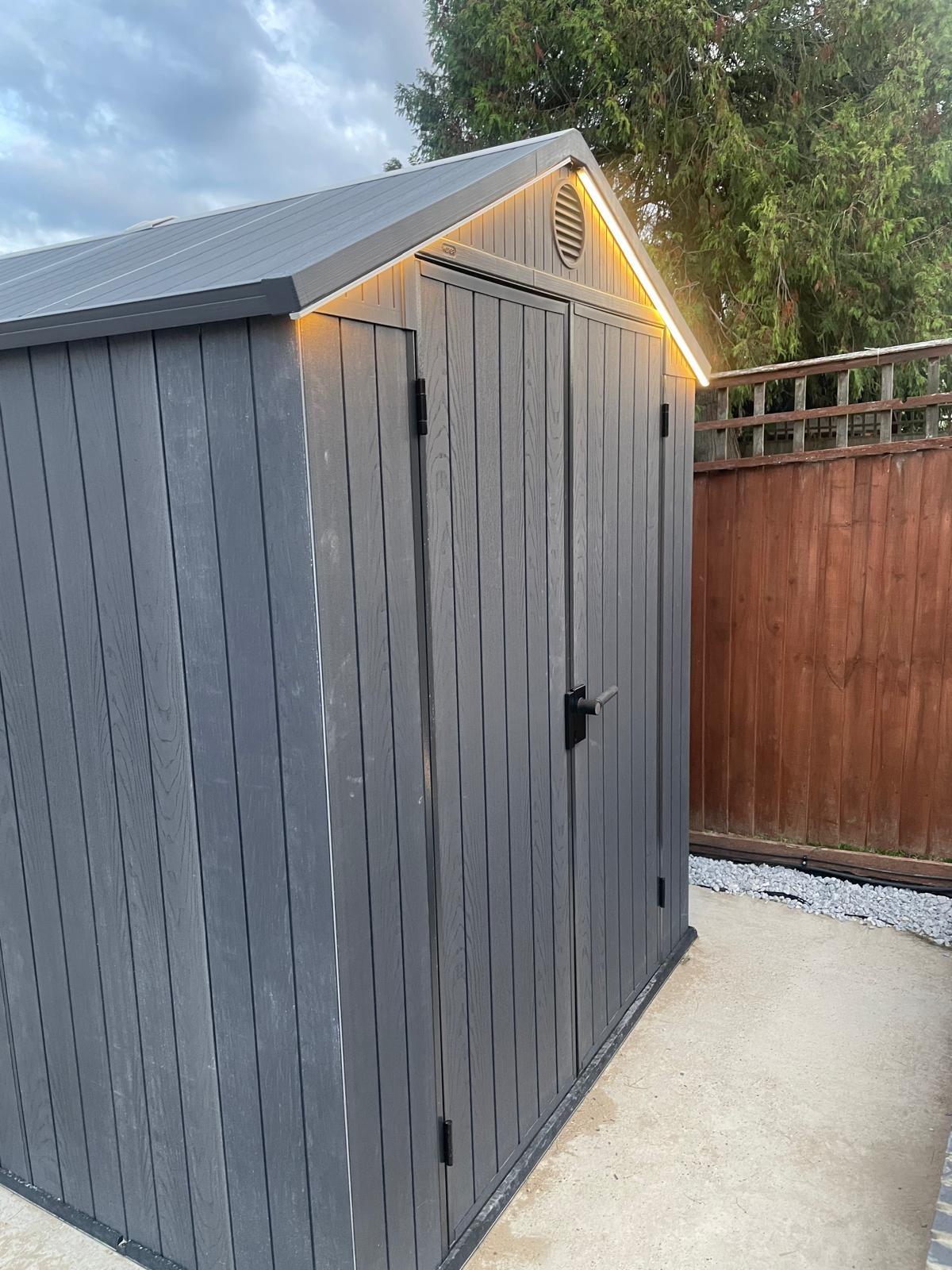 External lighting installed by ATS to improve visibility around a garden and outbuilding.