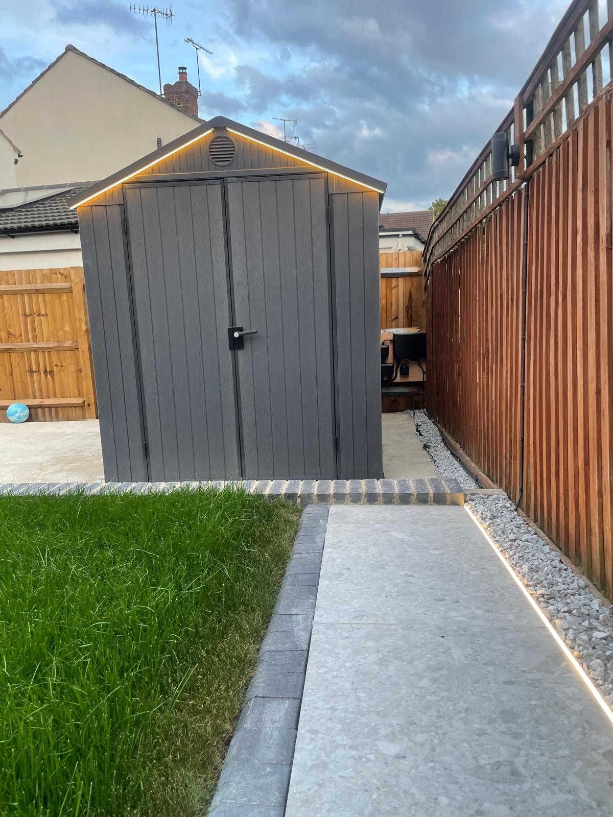 Security and access lighting installed around an outdoor residential area.